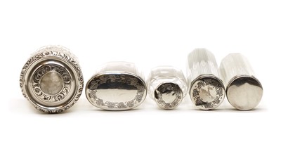 Lot 18 - Five silver lidded cut glass dressing table jars