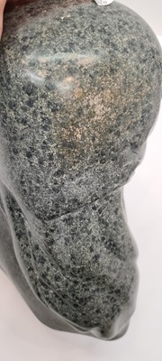 Lot 251 - A 20th century Inuit black and green granite sculpture