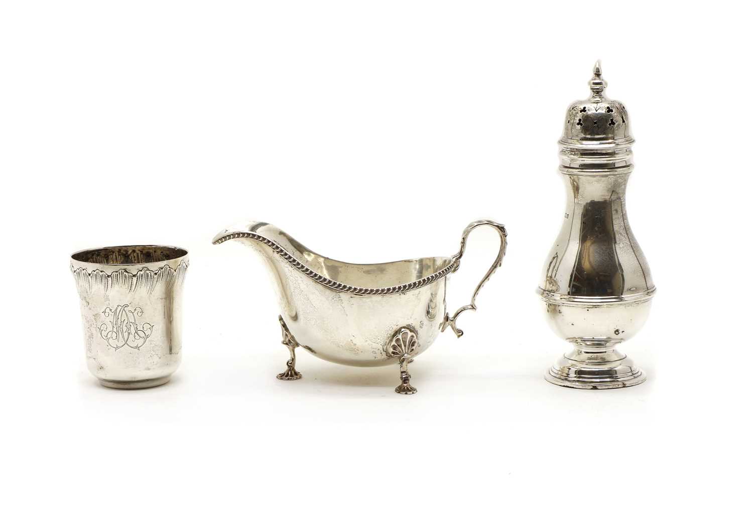 Lot 1 - A George III style silver sauce boat, a sugar castor and a beaker