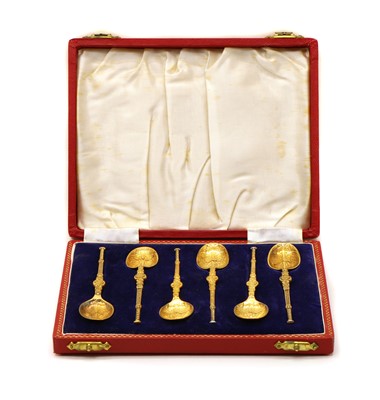 Lot 38 - A cased set of six silver gilt anointing spoons