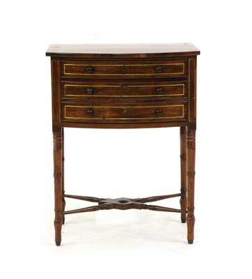 Lot 417 - A Regency bow fronted and brass inlaid rosewood work table