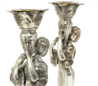 Lot 102 - Two WMF silvered figural candlesticks