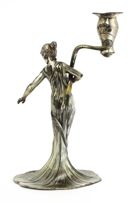 Lot 104 - A WMF silvered pewter figural candlestick