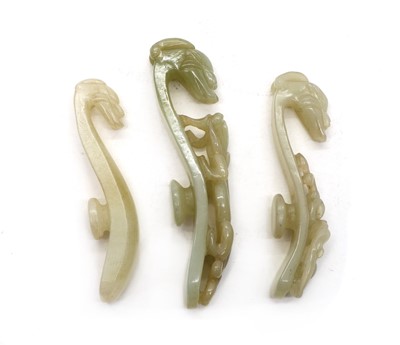 Lot 129 - A collection of three Chinese jade belt hooks