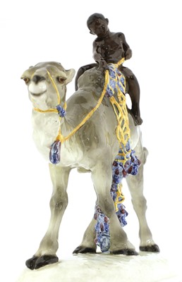 Lot 79 - A Goldscheider pottery group of a boy on a camel