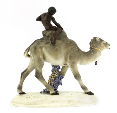 Lot 79 - A Goldscheider pottery group of a boy on a camel
