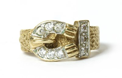 Lot 80 - A 9ct gold cubic zirconia buckle ring