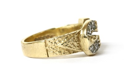 Lot 80 - A 9ct gold cubic zirconia buckle ring