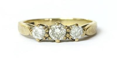 Lot 155 - A 9ct gold three stone diamond ring