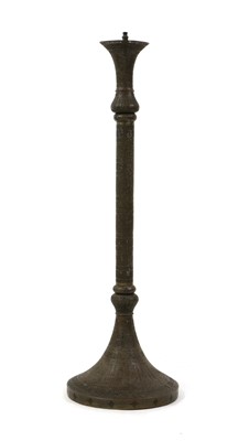 Lot 609 - An Islamic pierced brass floor standing mosque lamp