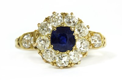 Lot 28 - An Edwardian gold sapphire and diamond cluster ring