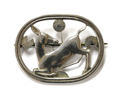 Lot 95 - A sterling silver kneeling deer brooch, by Georg Jensen