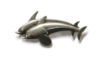 Lot 94 - A sterling silver dolphin brooch, by Georg Jensen