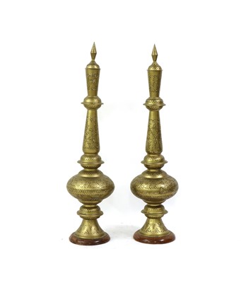 Lot 174 - A pair of Persian-style pierced brass table lamps
