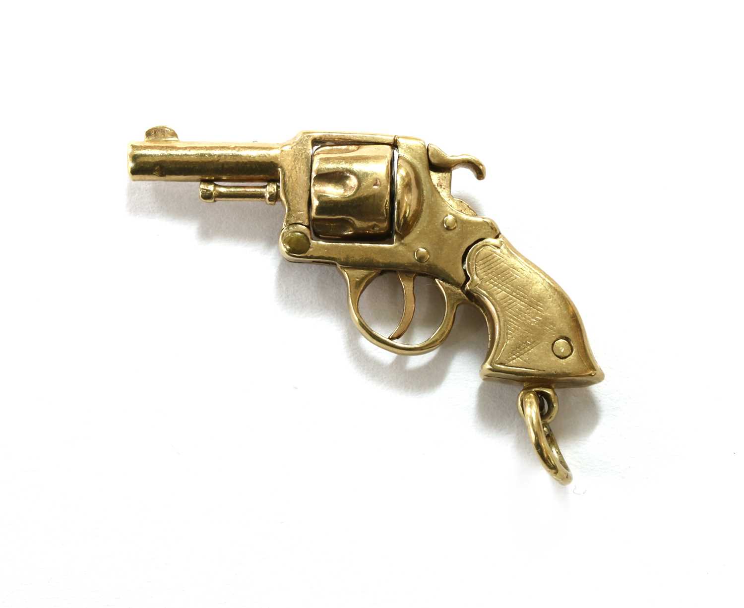 Lot 78 - A 9ct gold revolver charm,