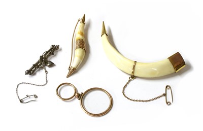 Lot 398 - A Victorian gold mounted boar's tusk brooch