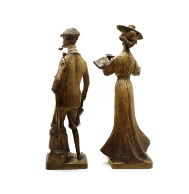 Lot 152 - A pair of Austrian terracotta figures of a gentleman and a lady