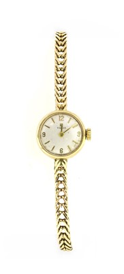 Lot 465 - A ladies' 9ct gold Tissot mechanical bracelet watch