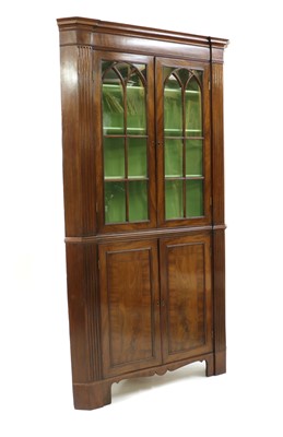 Lot 293 - A George III mahogany standing corner cupboard