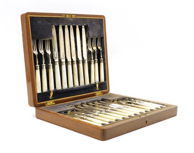 Lot 54 - A cased set of twelve silver and mother of pearl handled fruit knives and forks