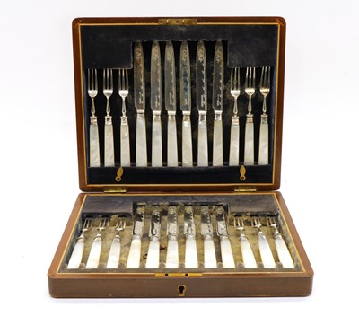 Lot 54 - A cased set of twelve silver and mother of pearl handled fruit knives and forks