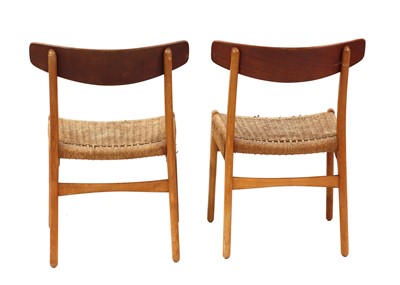 Lot 484 - A pair of 'CH23' teak dining chairs