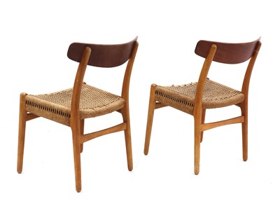 Lot 484 - A pair of 'CH23' teak dining chairs