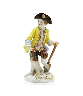 Lot 326 - A Meissen figure of a  young man in yellow