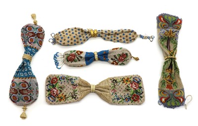 Lot 122 - A collection of five beadwork miser purses