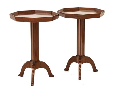 Lot 286 - A pair of walnut tripod tables
