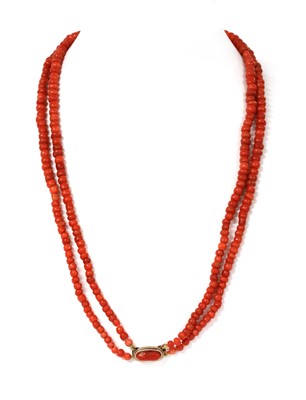 Lot 214 - A two row graduated coral bead necklace