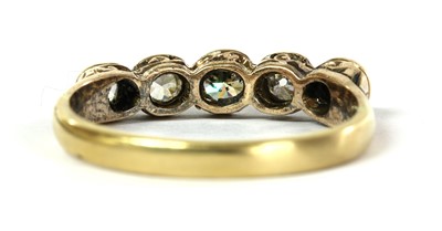 Lot 8 - A silver and gold, five stone diamond ring