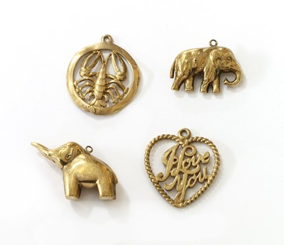 Lot 412 - Four 9ct gold charms