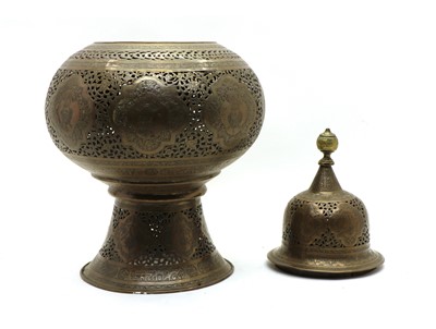 Lot 202 - A Persian pierced and engraved brass mosque lantern