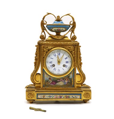 Lot 204 - A Louis XVI  style French gilt brass cased mantel clock
