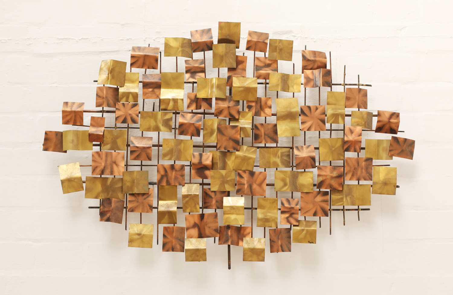 Lot 655 - A brass and copper wall sculpture