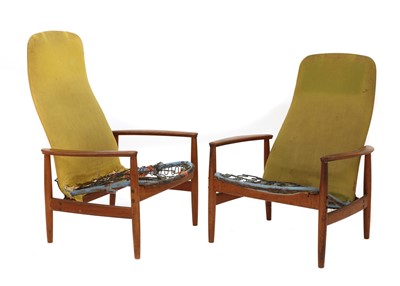Lot 521 - A pair of teak lounge armchairs