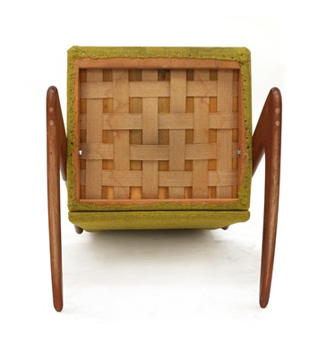 Lot 485 - A Danish teak 'Boomerang' rocking chair