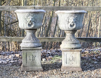 Lot 532 - A pair of composite stone garden urns