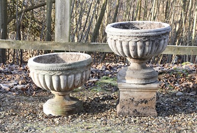 Lot 538 - A pair of composite stone garden urns