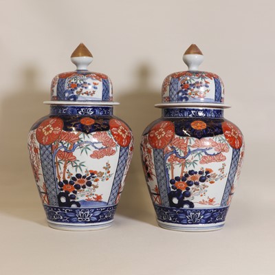 Lot 171 - A pair of Japanese Imari vases and covers