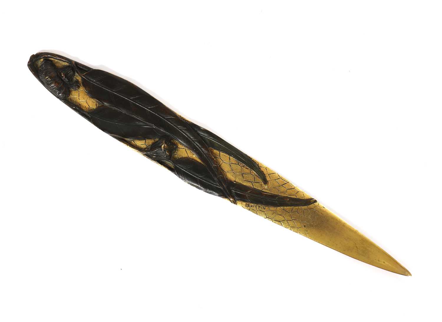 Lot 110 - An Art Nouveau patinated and gilt-bronze paper knife