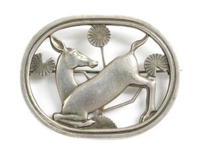 Lot 50 - A sterling silver kneeling deer brooch, by Georg Jensen