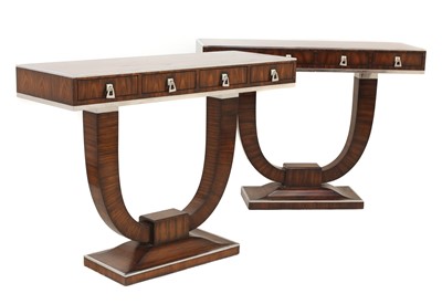 Lot 312 - A pair of Indian rosewood and chrome console tables