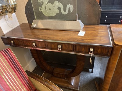 Lot 312 - A pair of Indian rosewood and chrome console tables