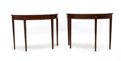 Lot 405 - A pair of George III style inlaid mahogany console tables