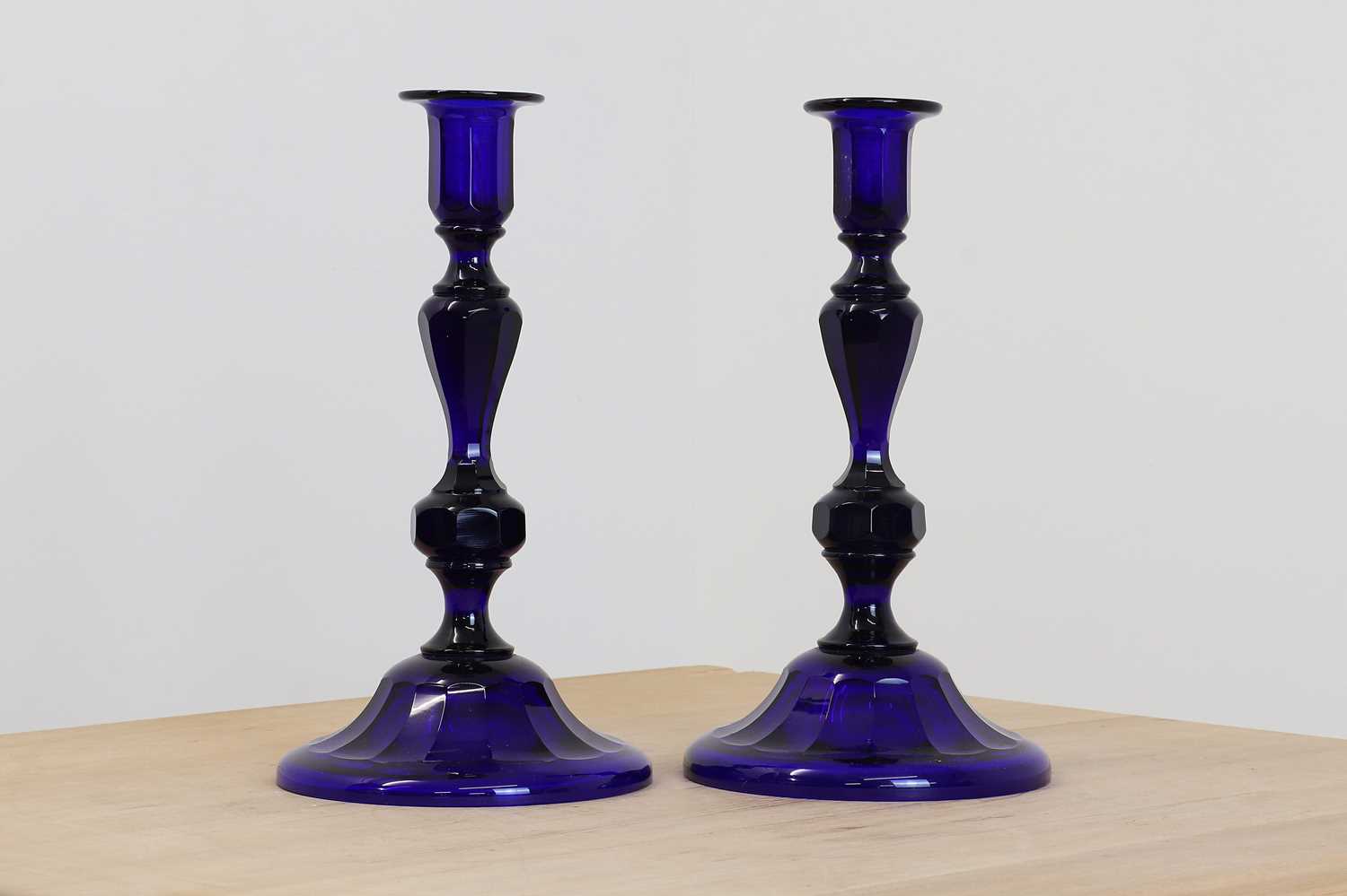 Lot 119 - A pair of Bristol blue glass candlesticks