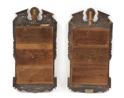 Lot 514 - A pair of George II-style walnut and parcel-gilt pier mirrors