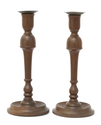 Lot 263 - A pair of Cotswold School walnut candlesticks