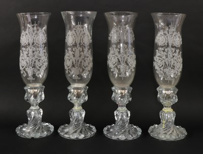 Lot 215 - A series of four hurricane shade candlestick lights